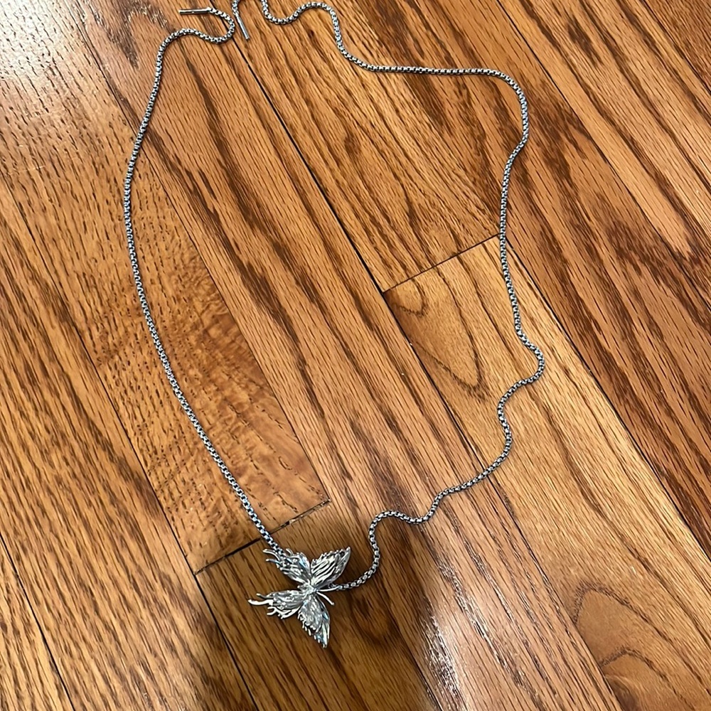 Silver butterfly necklace bought from “Cider”